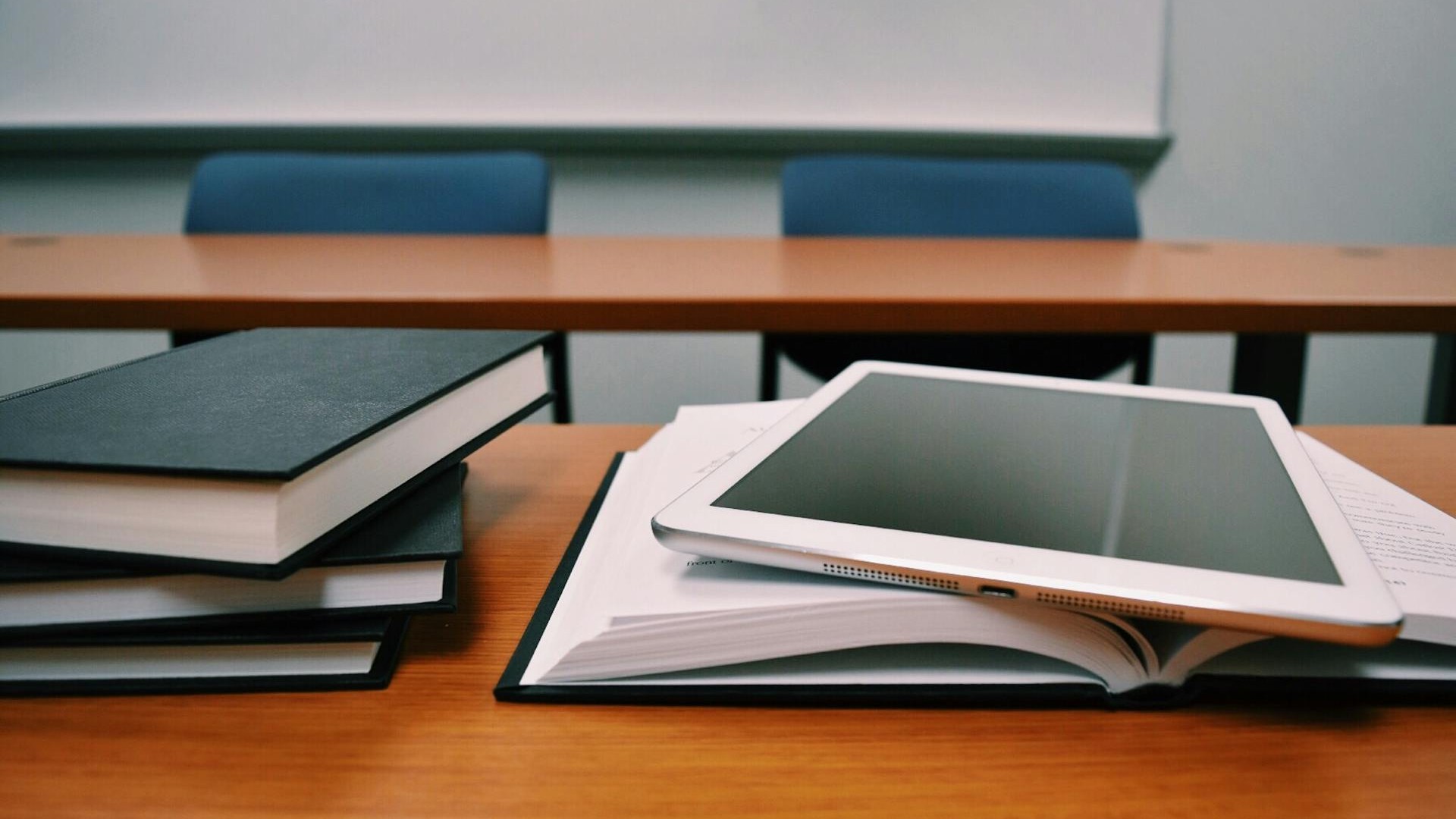 silver-ipad-on-white-book-page